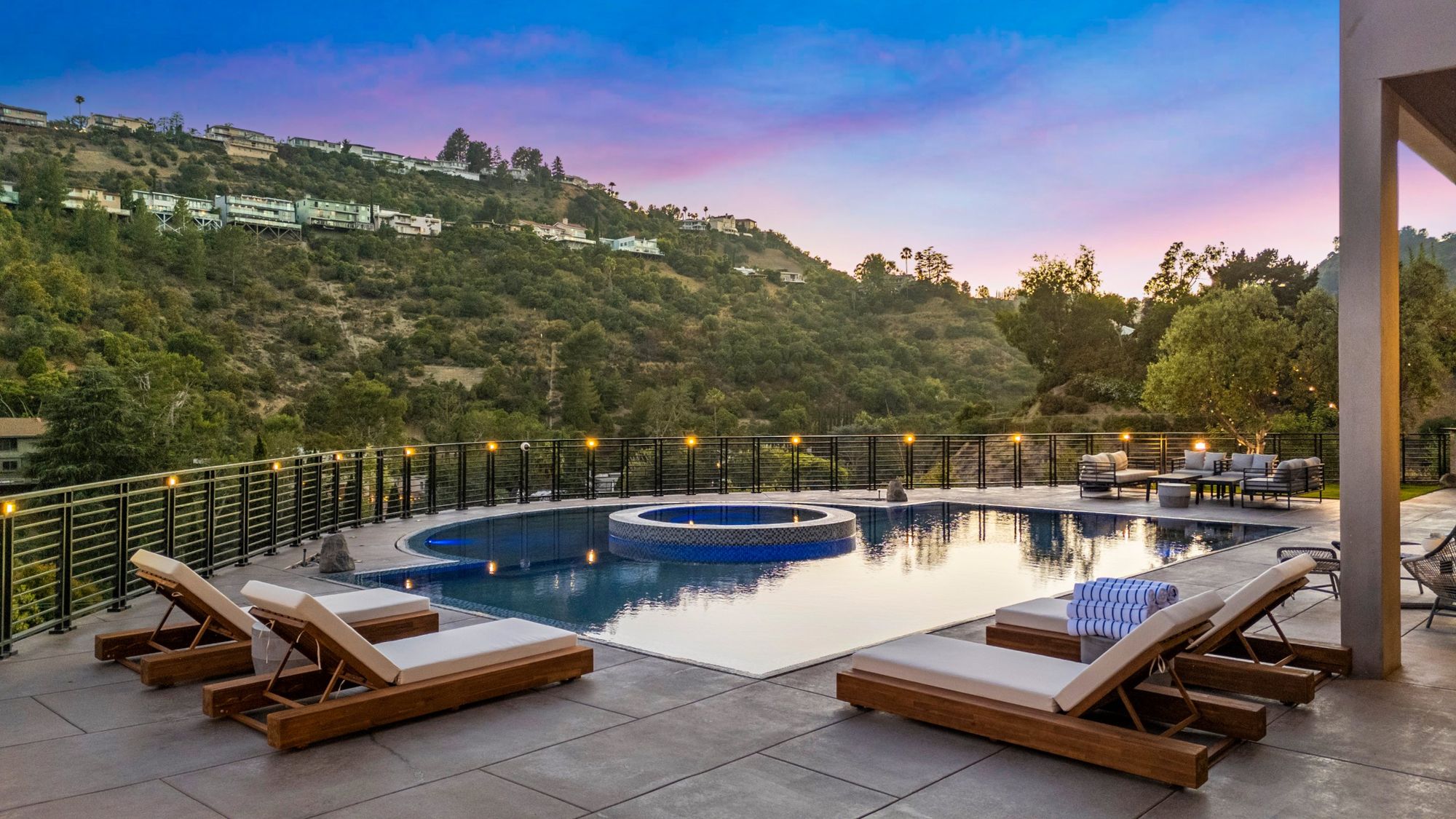 Pool and spa at twilight with the canyon beyond